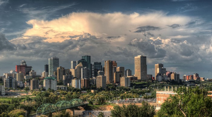 Edmonton skyline with dramatic clouds and a bridge
