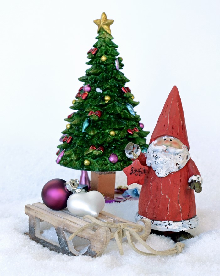 Christmas tree, Santa Claus, sled, and ornaments in snow