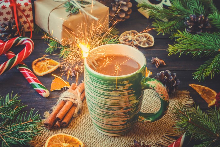 Christmas hot chocolate with sparkler and cinnamon