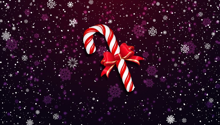 Christmas candy cane with red bow and snowflakes