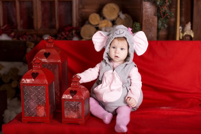 Baby in mouse costume with lanterns