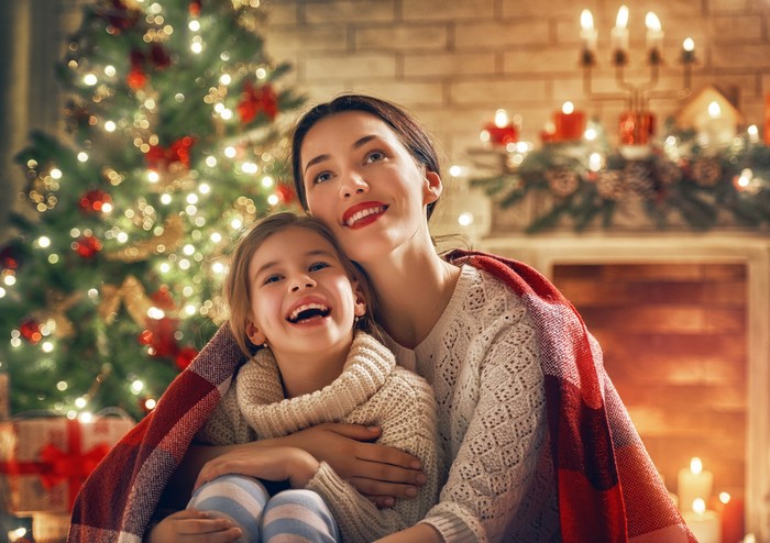 Mother and Daughter by Christmas Tree