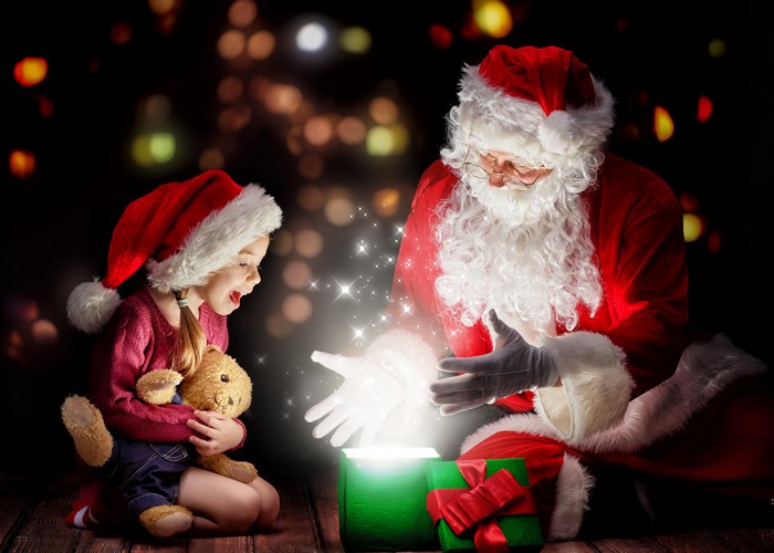 Santa Claus and a Girl Opening a Magical Gift