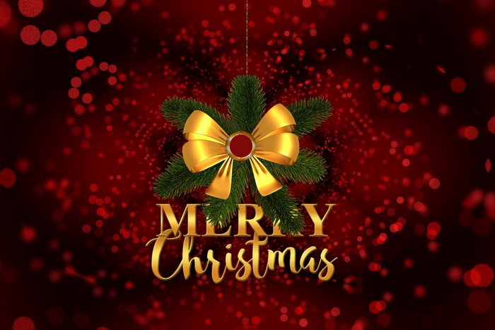 Merry Christmas golden text with pine branch and bow