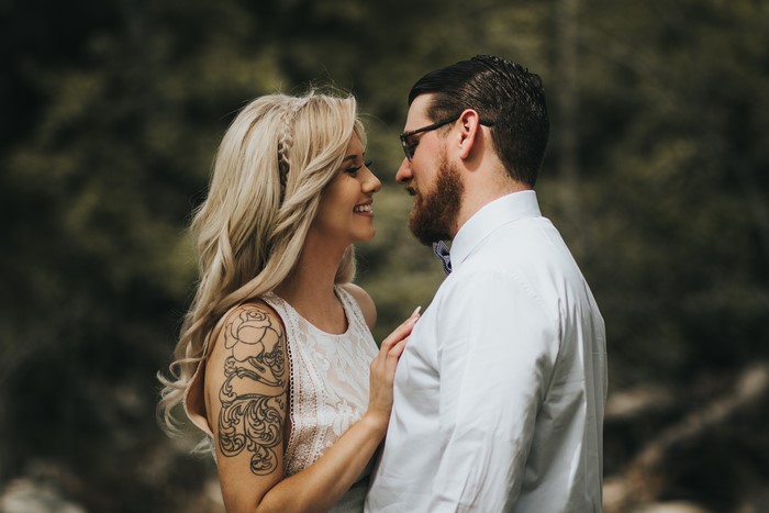 Couple in love with tattoos and glasses