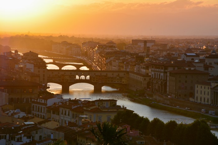 Florence, Italy at sunset with Arno River and Ponte Vecchio