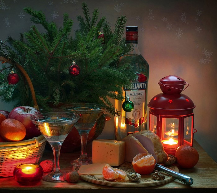 Christmas still-life with fir branches, fruit, cheese, and wine