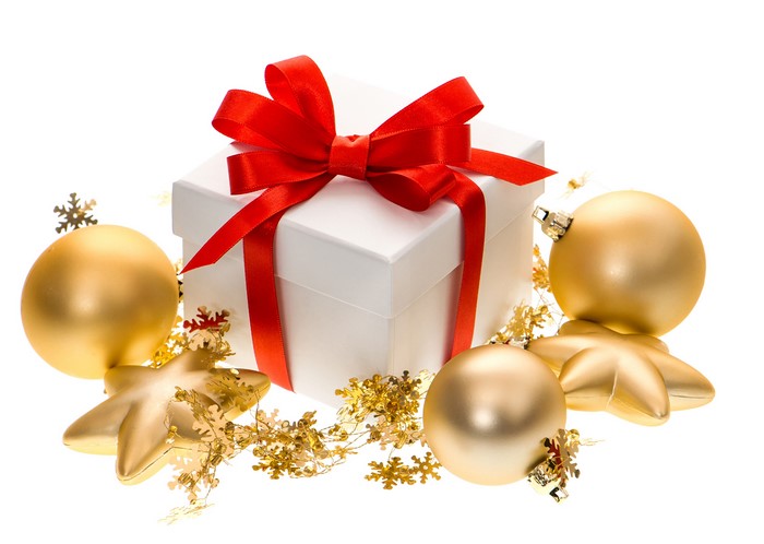 White gift box with red ribbon and gold Christmas ornaments