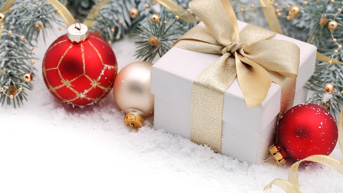 Christmas gift box with ornaments and snow
