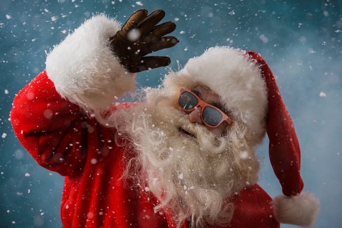 Santa Claus wearing sunglasses in the snow