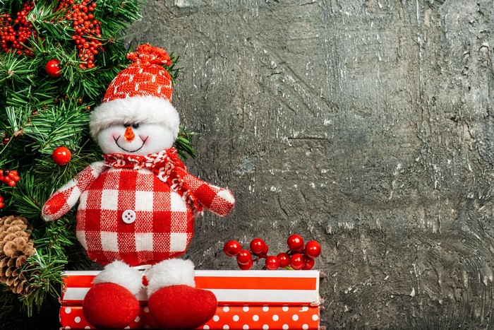 Christmas snowman with pine tree and berries