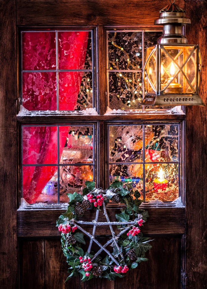 Christmas window with wreath and lantern