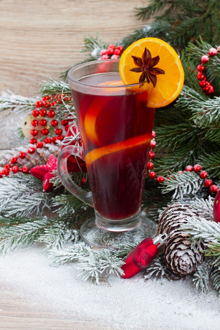 Mulled wine with orange and star anise on a Christmas table