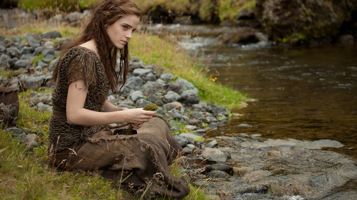 Emma Watson from Noah sitting by a stream