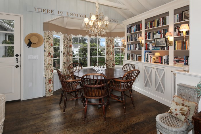Dining room with bookshelves and chandelier