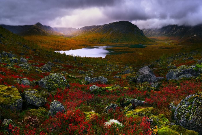 Autumnal landscape with lake and rocky terrain in Russia