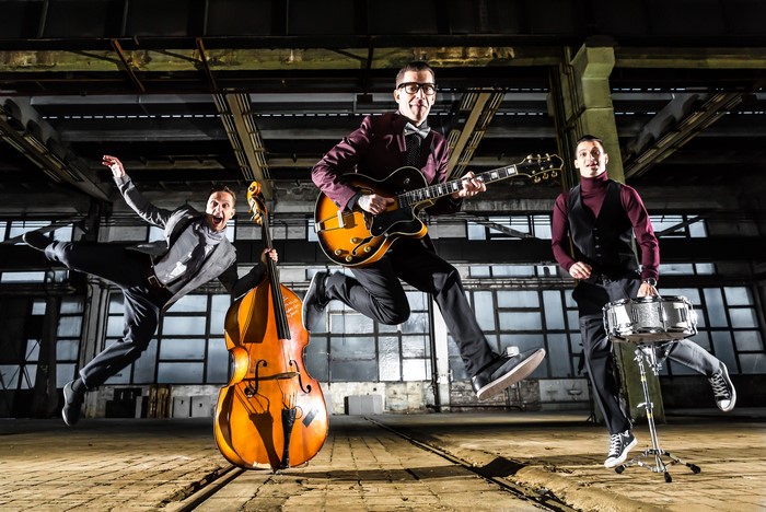 Three Men Playing Musical Instruments and Jumping