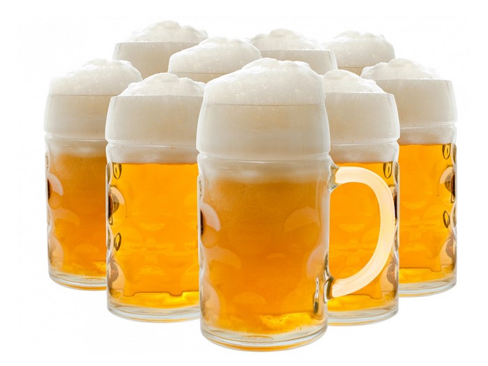 Several mugs of beer with foam