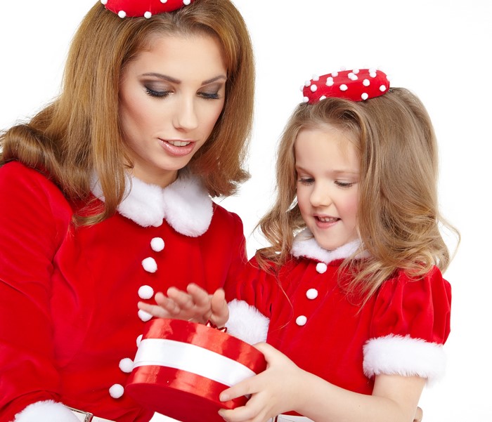 Mother and daughter opening a Christmas gift