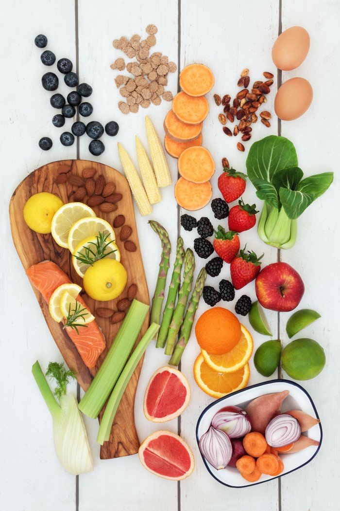Healthy Food Assortment: Fruits, Vegetables, Fish, Eggs, Nuts
