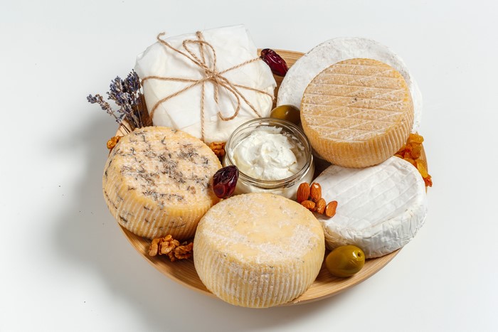 Cheese platter with nuts, olives, and dried fruit