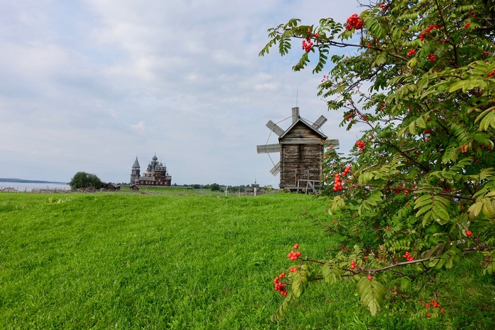 Wooden church and windmill on Kizhi Island, Russia