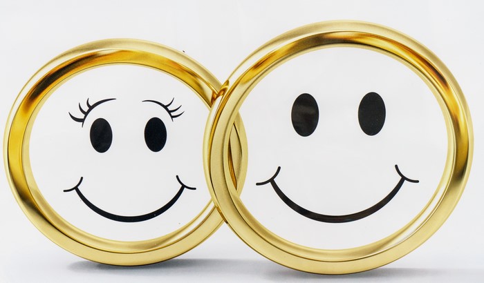 Two gold rings with smiley faces