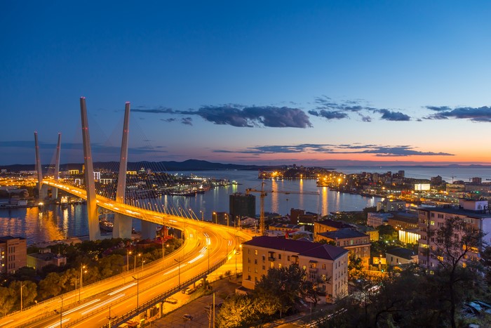 Vladivostok cityscape with Golden Bridge at dusk
