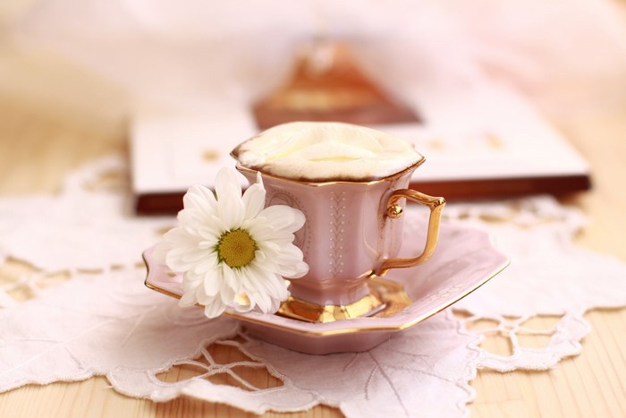 4K Coffee Cappuccino with Camomiles in a Cup