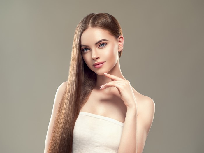 Elegant Young Woman with Long Brown Hair