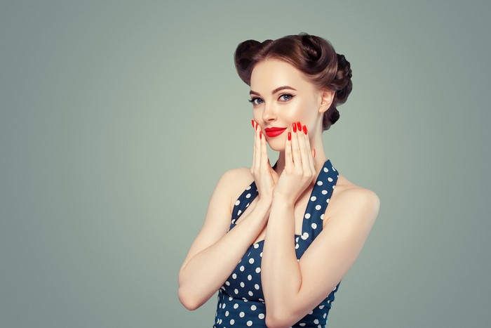 Woman with retro hairstyle and red lipstick