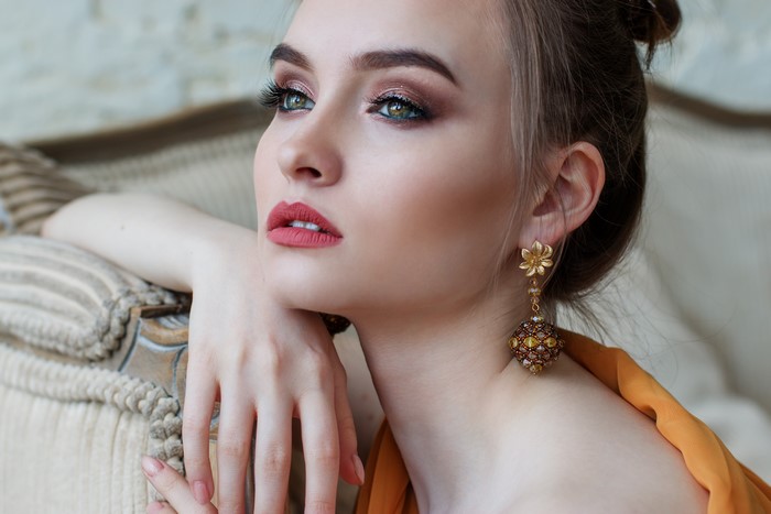 Woman with makeup and earrings