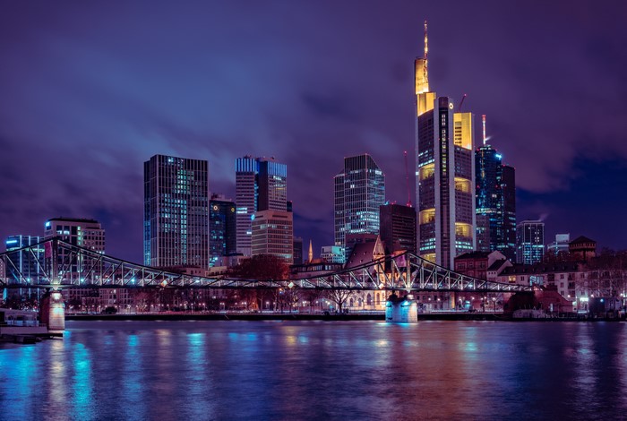 Frankfurt skyline with skyscrapers and bridge at night