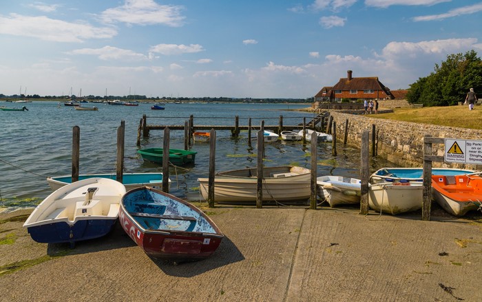 Boats moored at Bosham Quays, England