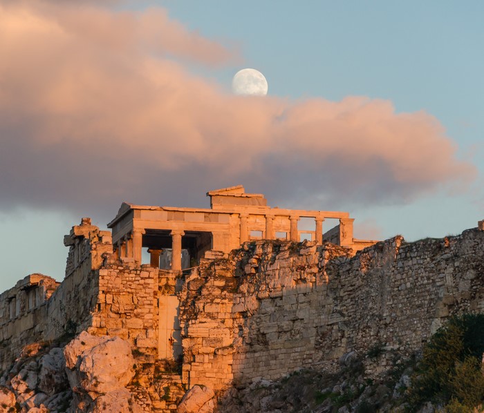 Moon over the Athenian Acropolis ruins in Greece