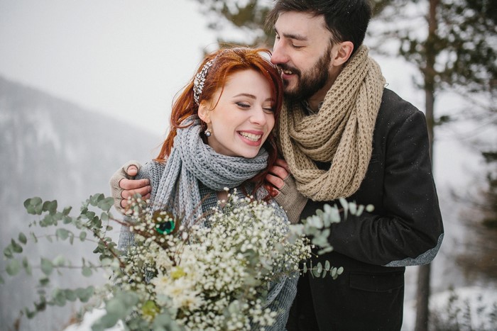 Couple in winter with flowers