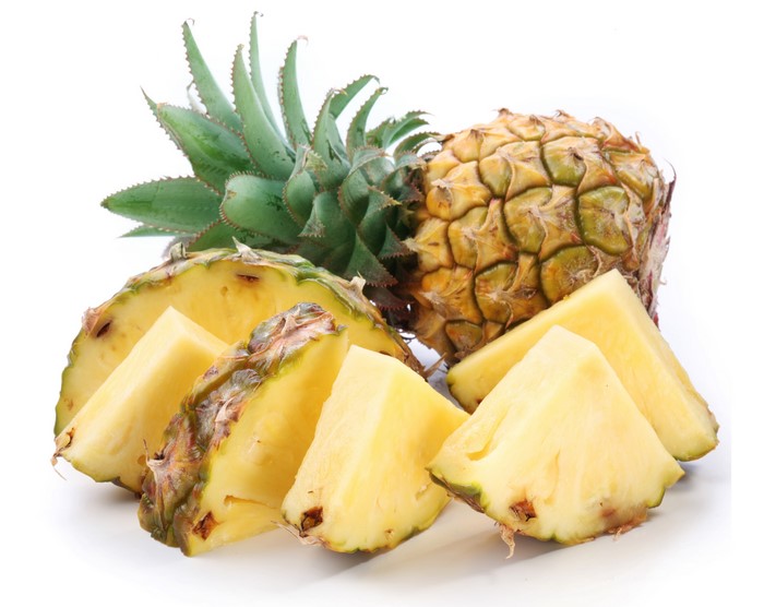 Pineapples, Sliced and Whole, on White Background