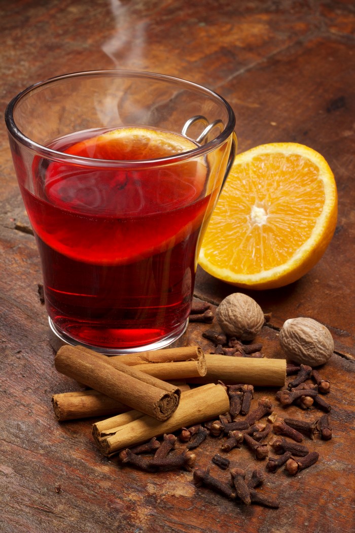 Hot drink with orange, cinnamon, cloves, and nutmeg