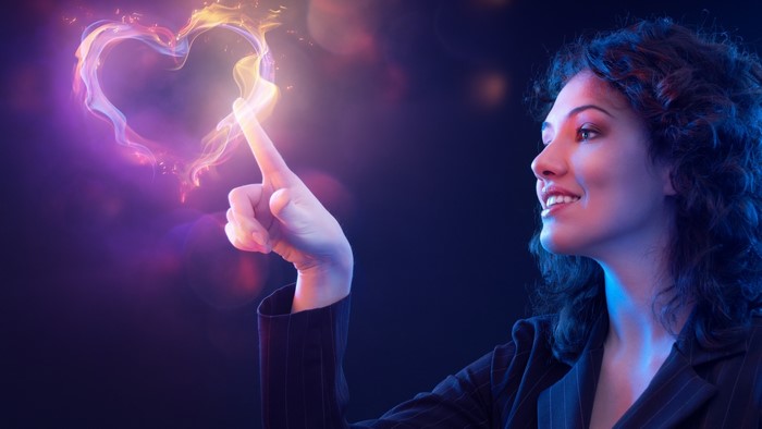 Woman touching a magical heart shape