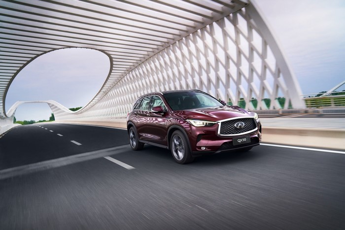 Infiniti QX50 wine color car in motion