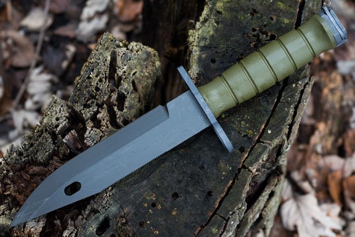 M9 Bayonet Knife on Wood Stump