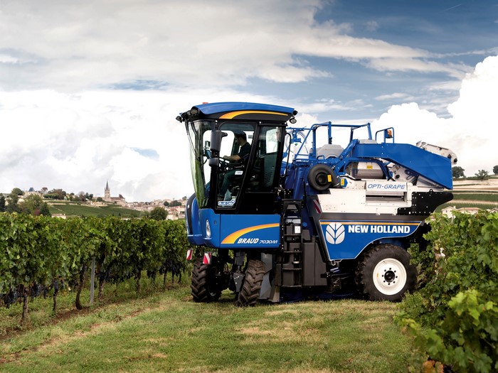 4K New Holland Braud 7030M grape harvester in vineyard