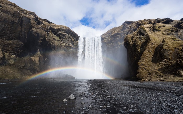 Skogafoss Waterfall with Rainbow in Iceland