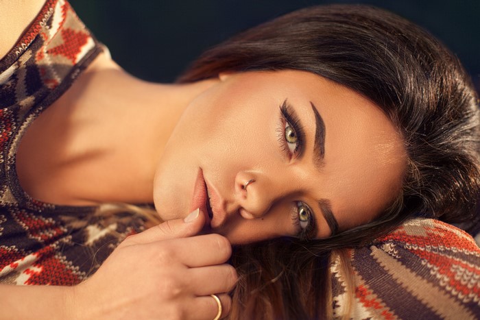Brunette girl with body piercing and ring