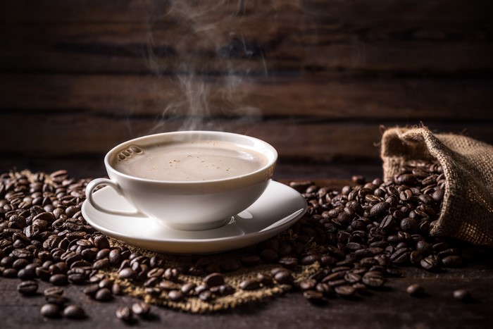 Cup of Coffee with Coffee Beans