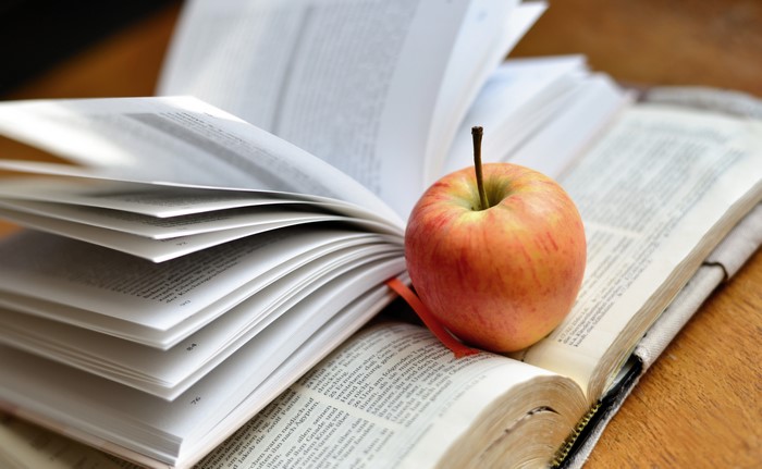 Apple on open books
