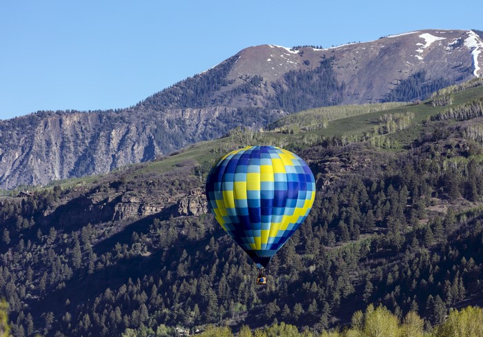 Hot air balloon over mountains