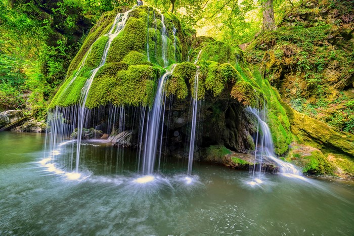 Bigar Waterfall in Romania covered in moss