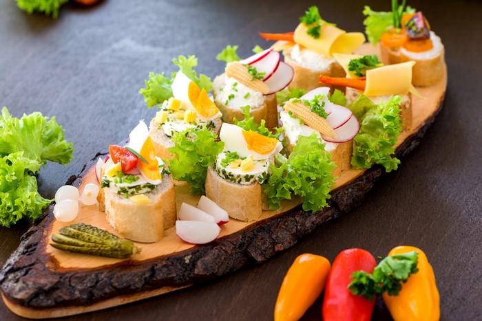 4K Appetizers on a Wooden Board with Vegetables