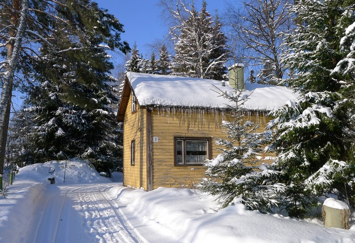 Yellow house in winter landscape, Kymenlaakso, Finland